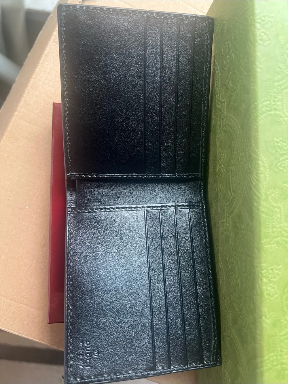 Gucci Black Leather Bifold Wallet with Gold Logo Accent